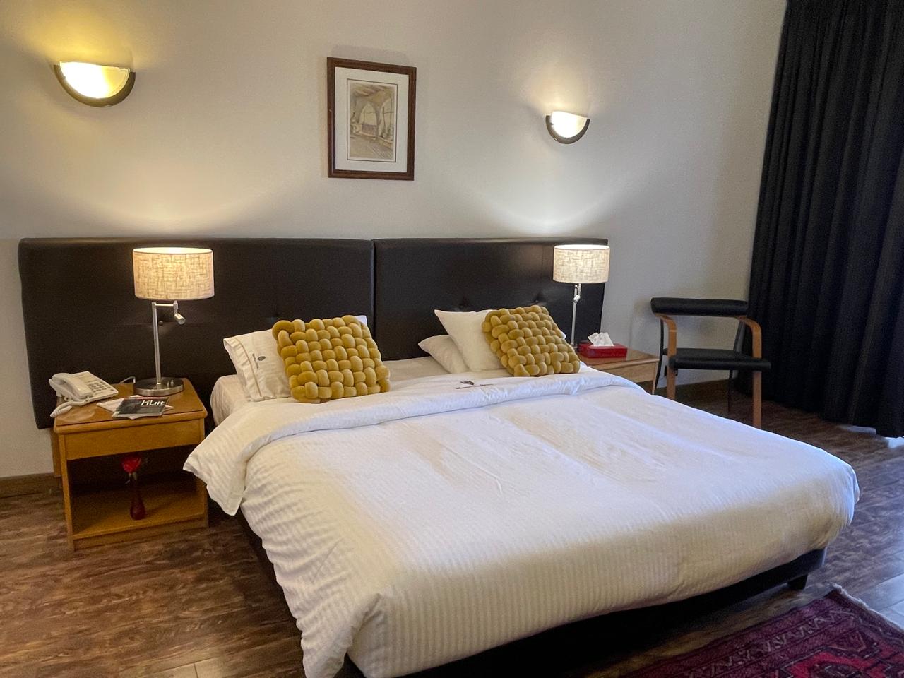 Family Suite at Marbella Hotel - spacious bedroom with king-size bed and modern lighting
