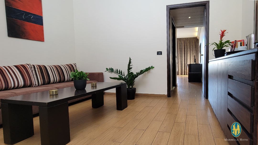 Family Suite at Marbella Hotel - modern living area with plants and wooden flooring
